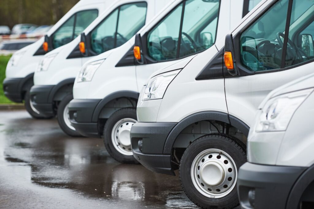 White used vans on forecourt